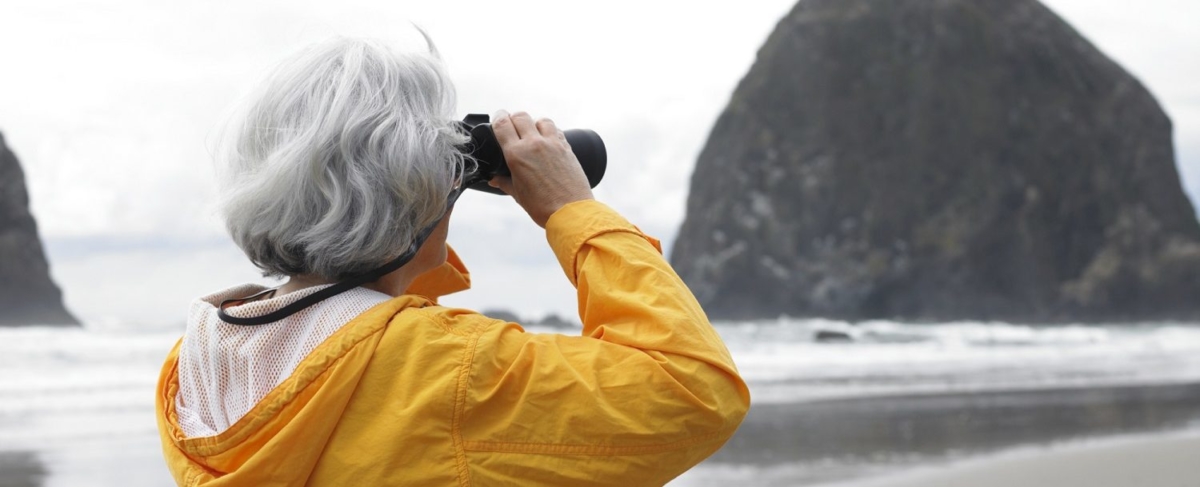 Older woman with binoculars.