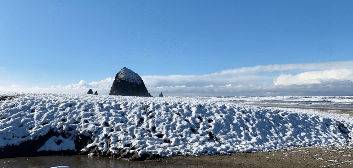 Snow on the coast near Haystack Rock.