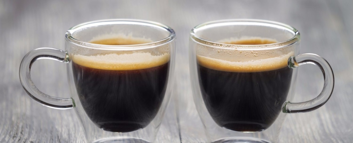 Two glass cups of coffee.