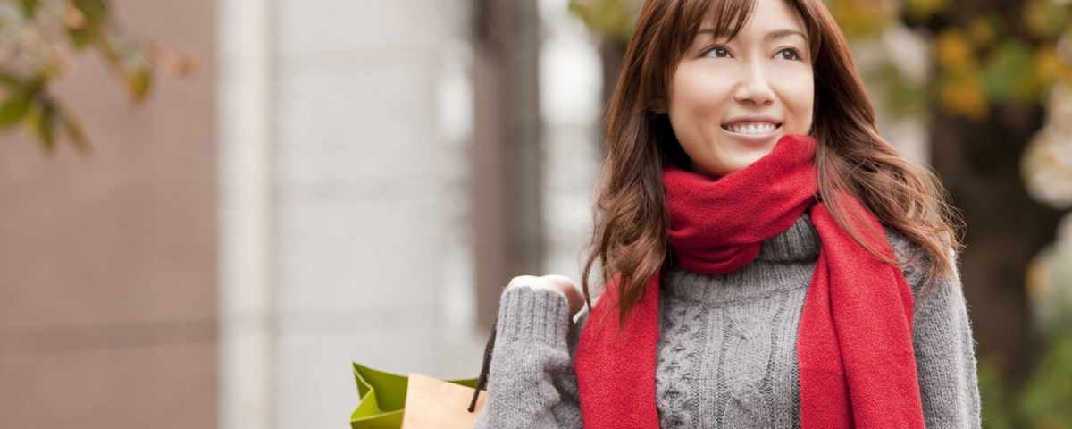 Woman with sweater and scarf.