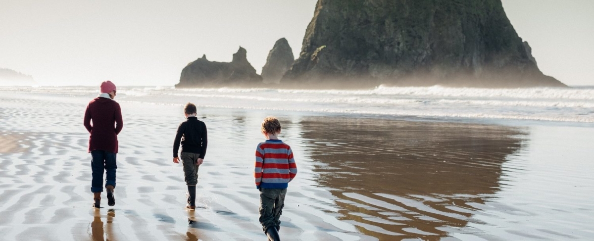 Family walking on the beach.