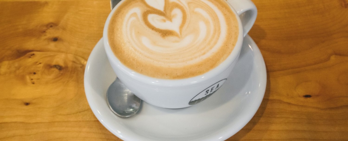 Close up of latte with foam heart.