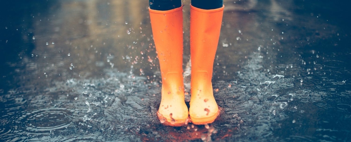 Rain boots in the water.
