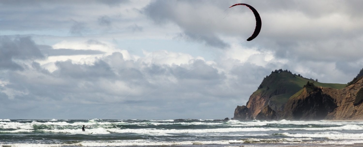 Kitesurfer on the coastal waves.