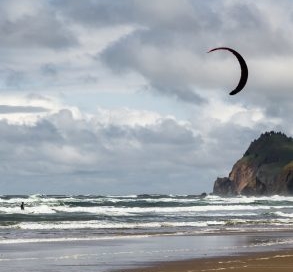 Kitesurfer on the coastal waves.