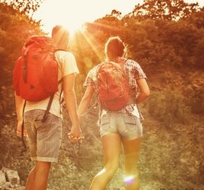 Hiking couple holding hands.