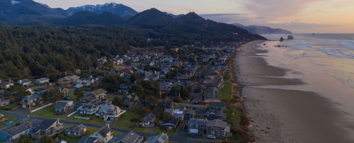 Cannon beach coastal homes at dusk.