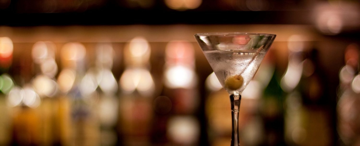 Close up of a martini with an olive.