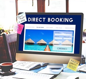 Stock photo of computer monitor. Text: Direct Booking.