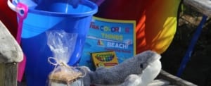 Kids club kit: bucket, whale toy, smores, coloring book.