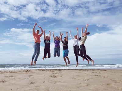 Group jumping at the beach.