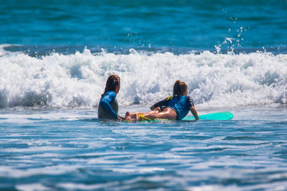 Photo of a Girl Enjoying Surf Lessons in Oregon.