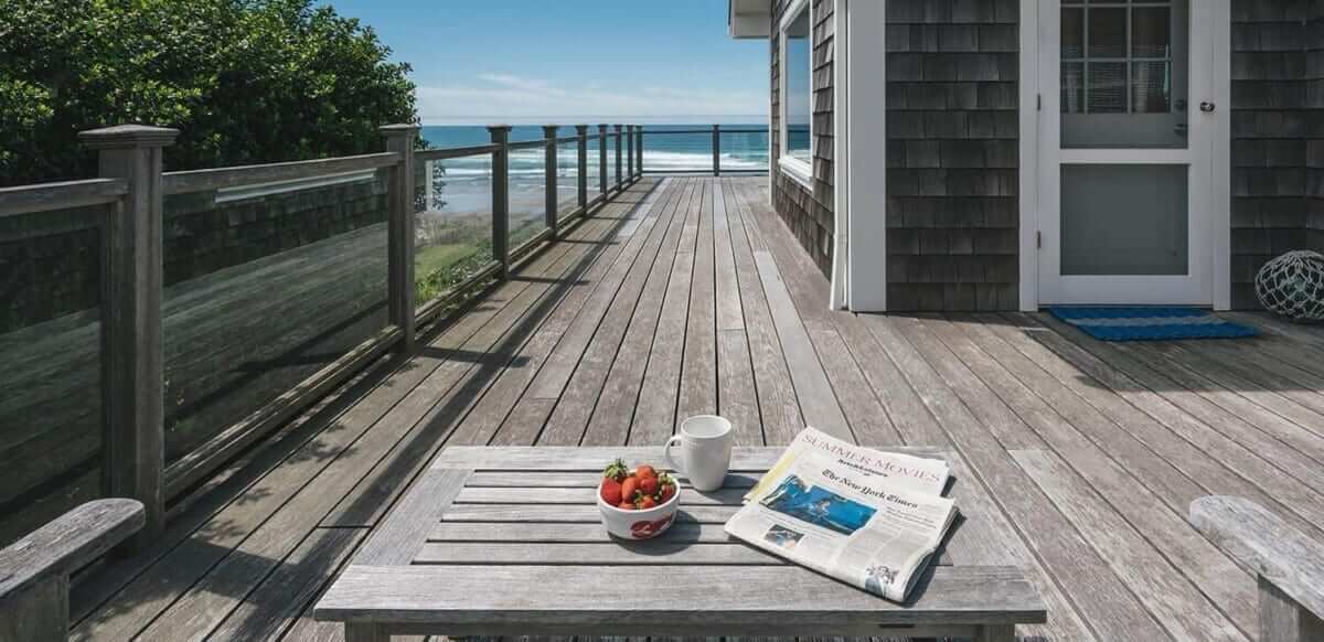 Vacation home deck with newspaper.